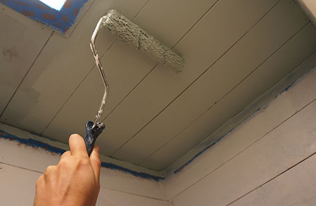 Painting the closet ceiling with a mini roller
