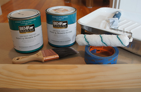 Paint roller and tray, paint brush, tape, lumber and two quarts of Behr paint 