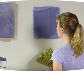Woman staring at patches of paint on the wall