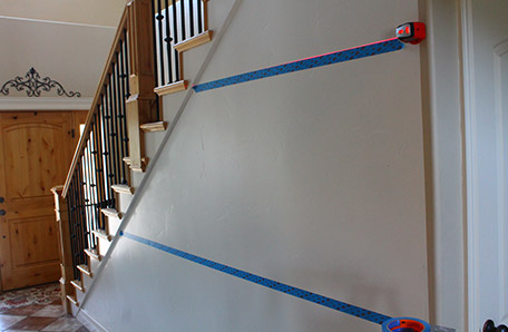 Use painter’s tape to mark the location of the horizontal boards