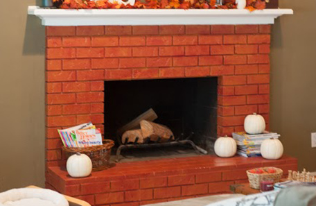 The original red brick fireplace