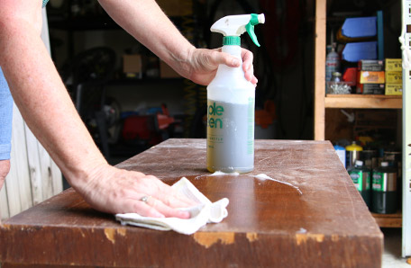 Cleaning the dresser with a rag and all-purpose cleaner