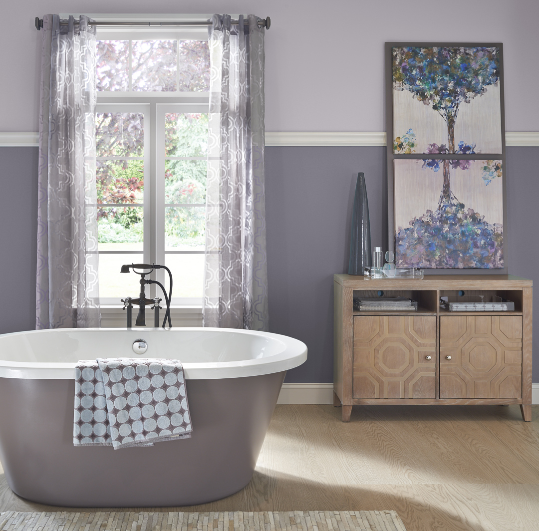 Inspirational small bathroom image with dark purple and light purple split walls and white trim.