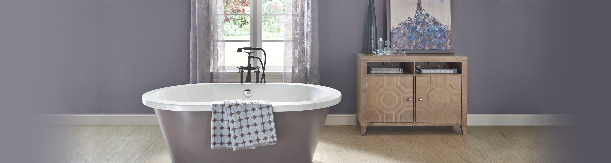 Inspirational bathroom image with dark purple and light purple split walls and white trim.