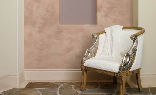 Classic chair in front of white, pink and color designed wall