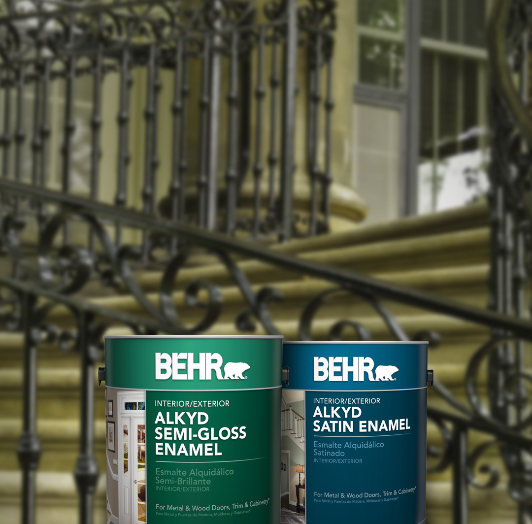 Two cans of Behr paint with metal railed stairs in the background, small image.
