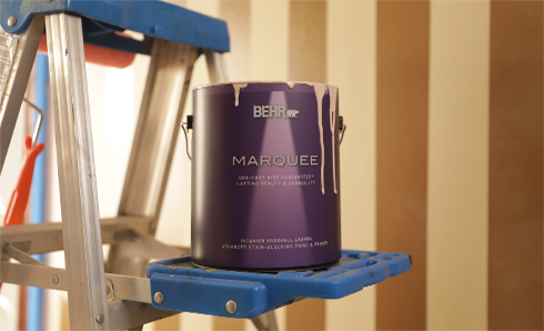 Can of Behr Marquee paint sitting on a ladder
